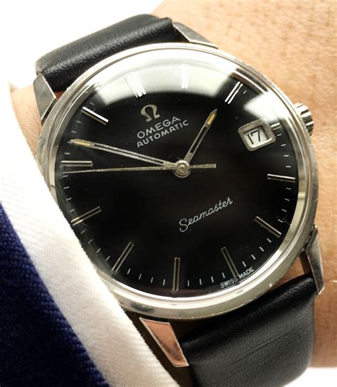 omega seamaster black dial vintage.